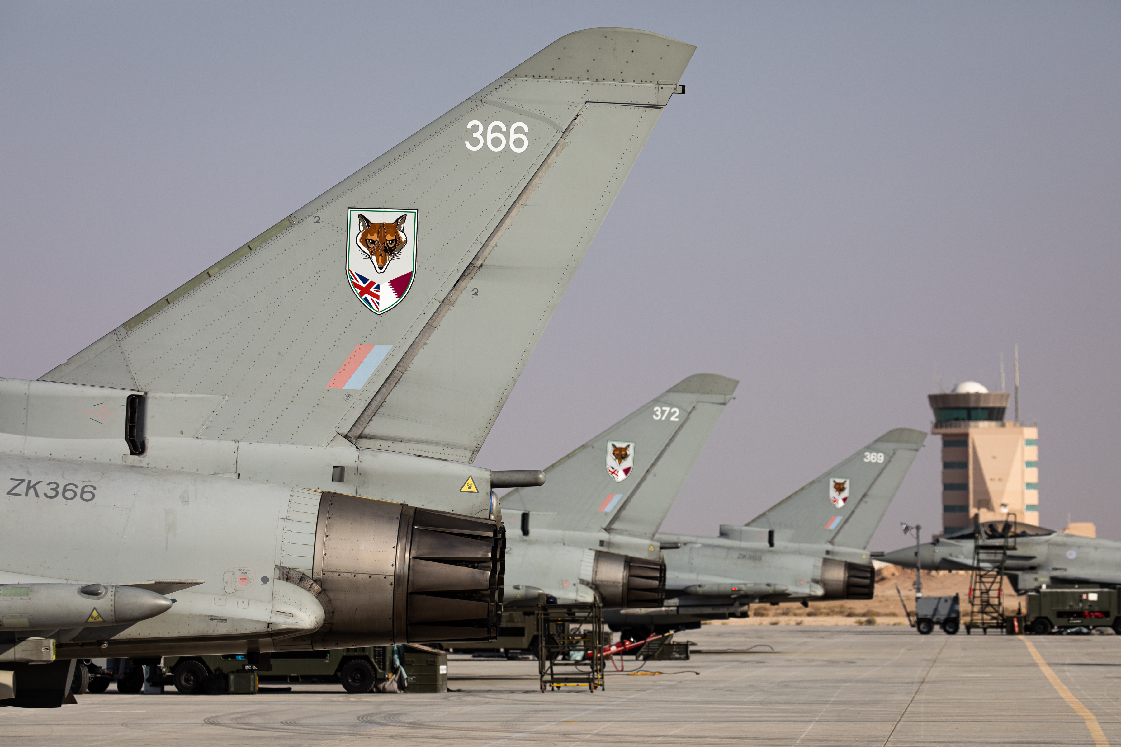 Tail end of Typhoon aircraft lined up on the airfield